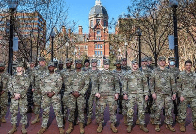 Group of national guardspeople in front of the Hopkins dome
